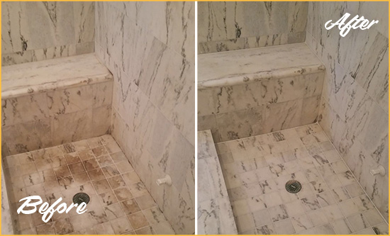 Before and After Picture of a Dirty Stanwood Marble Shower Cleaned to Eliminate Dark Stains